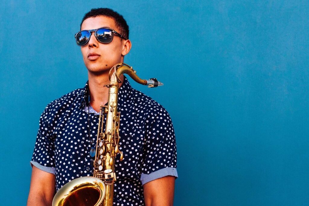 Man Holding Saxophone Instrument